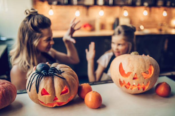 istock Mom with daughter on Halloween. 884616310