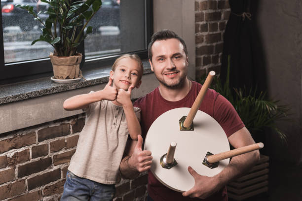 istock Daughter and father showing thumbs up 884629174
