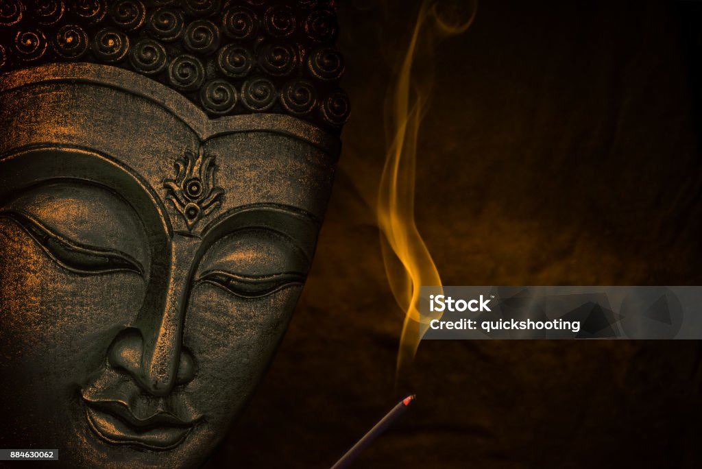 Buddha face Buddha face with incense stick Buddha Stock Photo