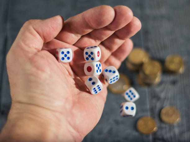 istock Play for money-tossing on the table with money dice. 884634342