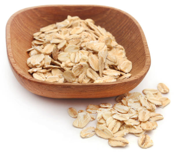 istock Oats in wooden bowl 884635006
