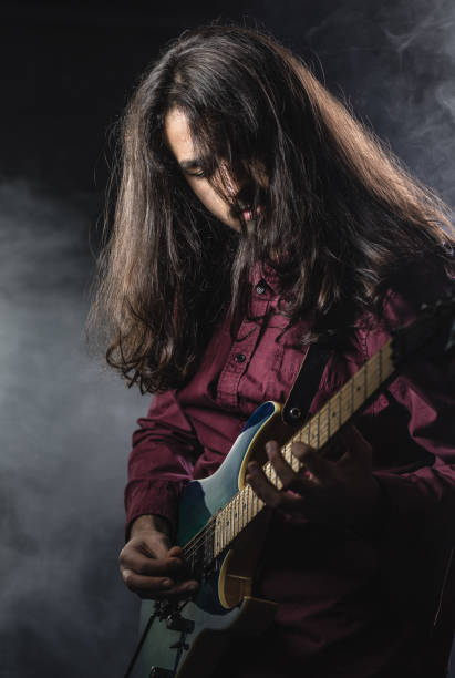 istock Portrait of a Young Guitarist 884635466