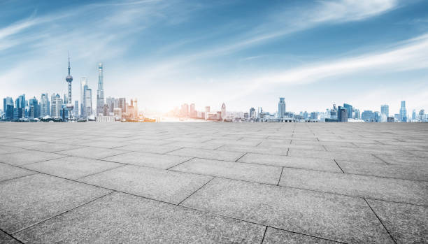 istock empty brick floor and cityscape of shanghai in blue sky 884635724