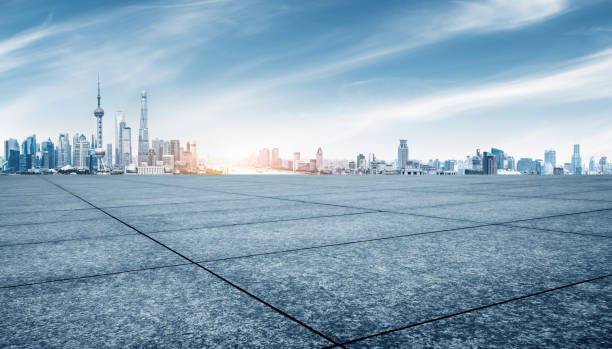 istock empty brick floor and cityscape of shanghai in blue sky 884635726