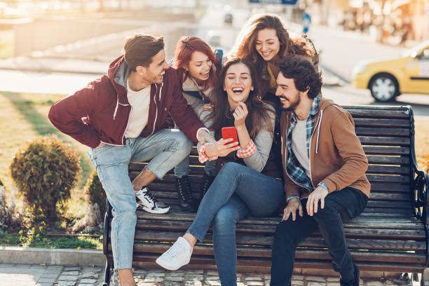 istock Group of friends laughing at a message 884638022