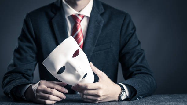istock Mask and businessman 884639004