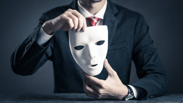 istock Mask and businessman 884639096