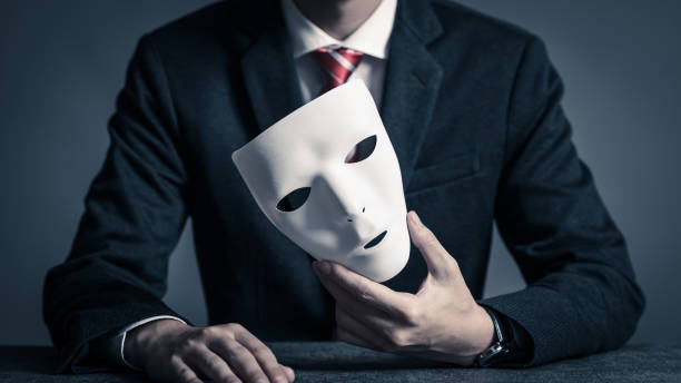 istock Mask and businessman 884641232