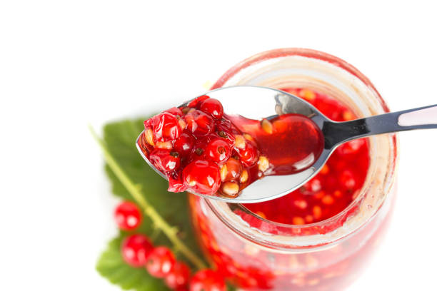 istock Red current homemade jam on white background 884641522