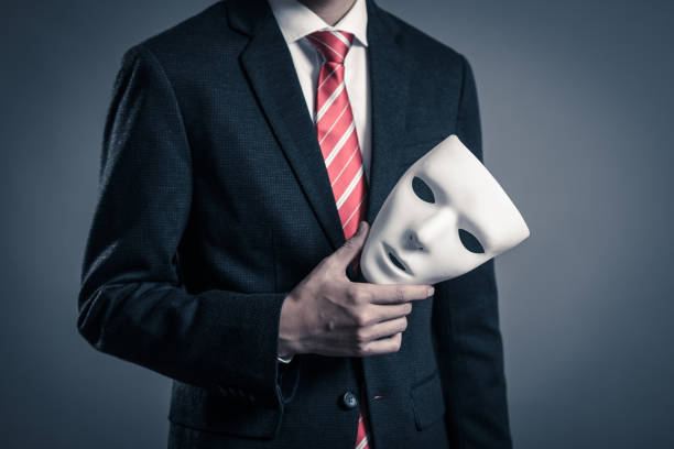 istock Mask and businessman 884641596