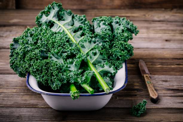istock Fresh raw green superfood kale curly cabbage leaves 884646664