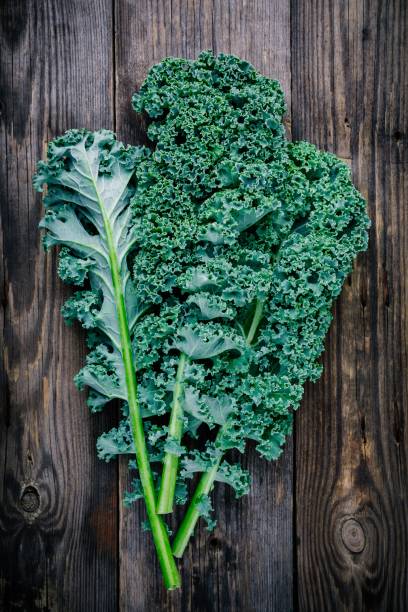 istock Fresh raw green superfood kale curly cabbage leaves 884646908