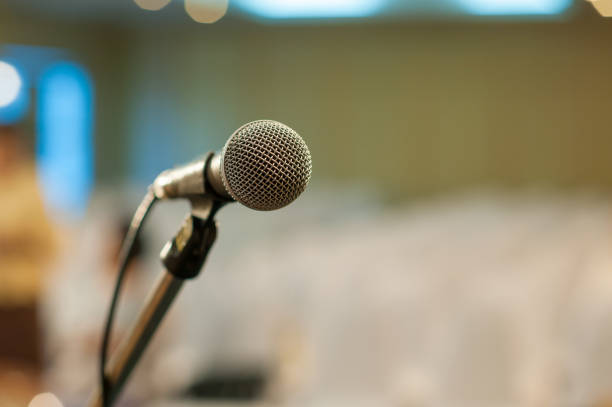 istock communication microphone on stage against a background of auditorium Concert stage 884647040