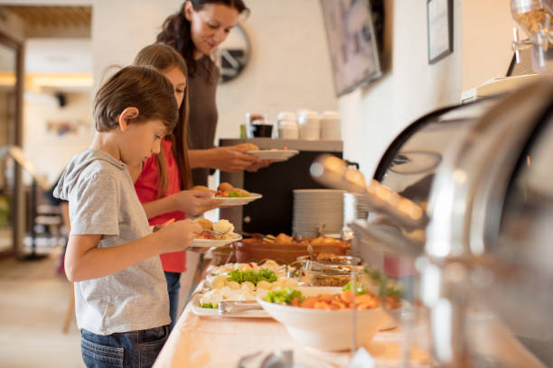 Breakfast in hotel restaurant Breakfast in hotel restaurant buffet hotel people women stock pictures, royalty-free photos & images