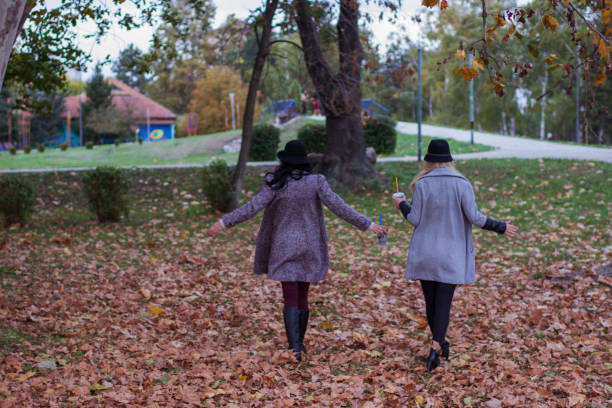 istock Two girls in the park 884649734