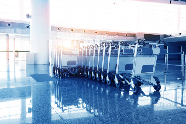 istock luggage carts at modern airport 884649788