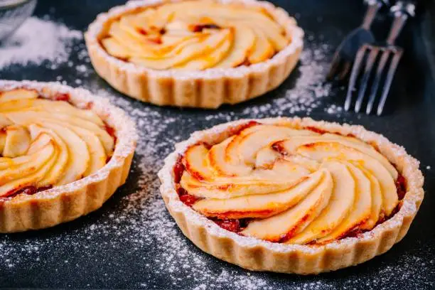 traditional pies apple tarts on wooden background