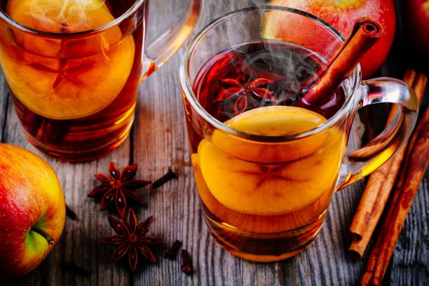 istock homemade hot mulled apple cider with a cinnamon stick 884656676