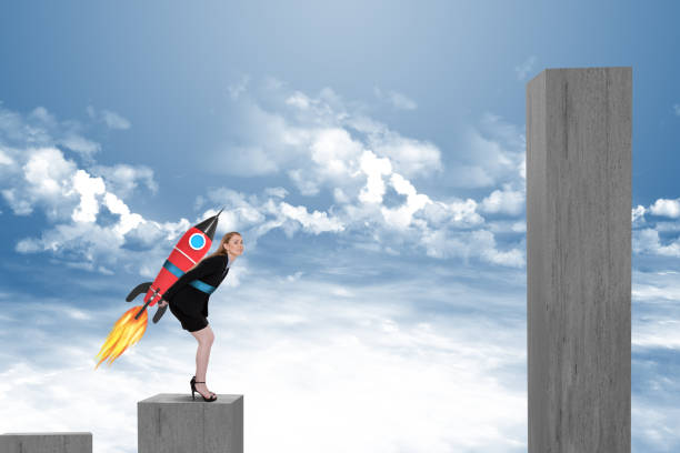 Businesswoman taking off with jet pack rocket on bar graph block
