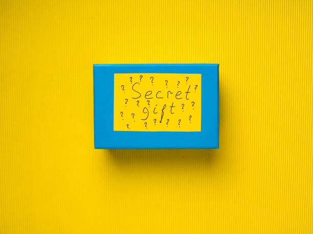istock Blue surprise gift box on yellow background 884671482