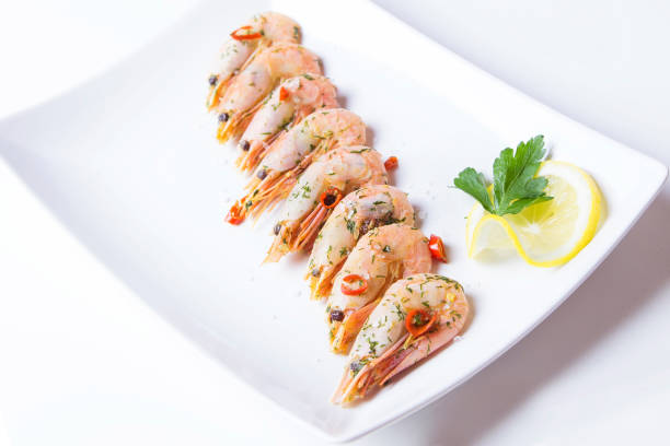 istock Prawns fried with garlic and chilli. Close-up, selective focus. 884675412