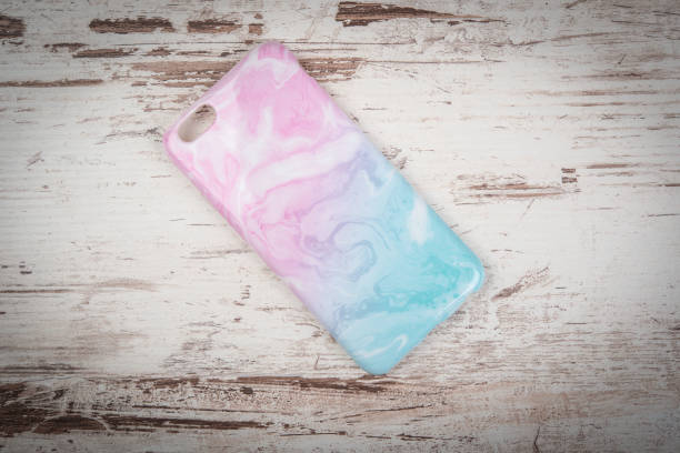 Mobile phone case on retro wooden background