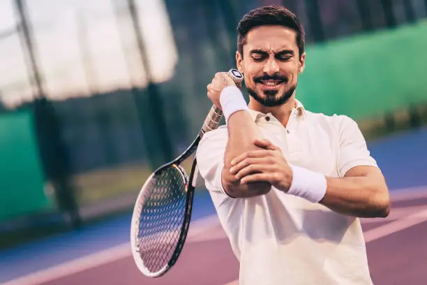 Photo of Man on tennis court.