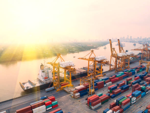 istock container,container ship in import export and business logistic,By crane,Trade Port , Shipping,cargo to harbor.Aerial view,Water transport,International,Shell Marine,transportation,logistic,trade,port 884699214