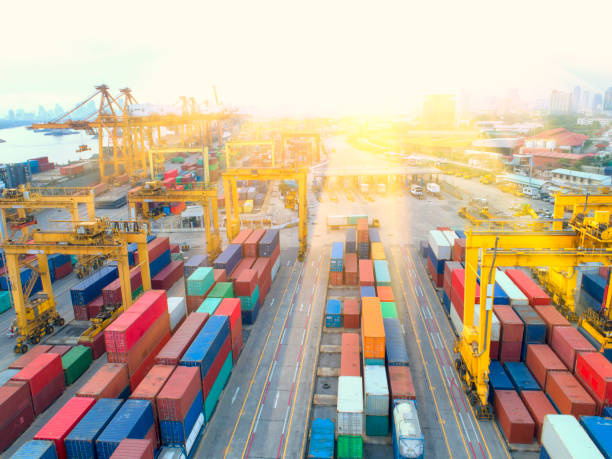 istock container,container ship in import export and business logistic,By crane,Trade Port , Shipping,cargo to harbor.Aerial view,Water transport,International,Shell Marine,transportation,logistic,trade,port 884699228