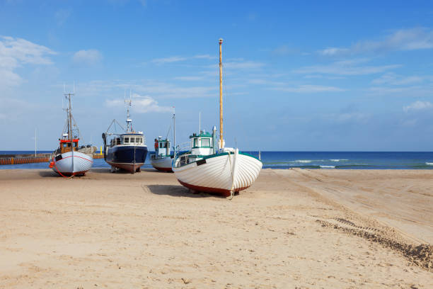 Fishing boats stranded on the beach at low tide