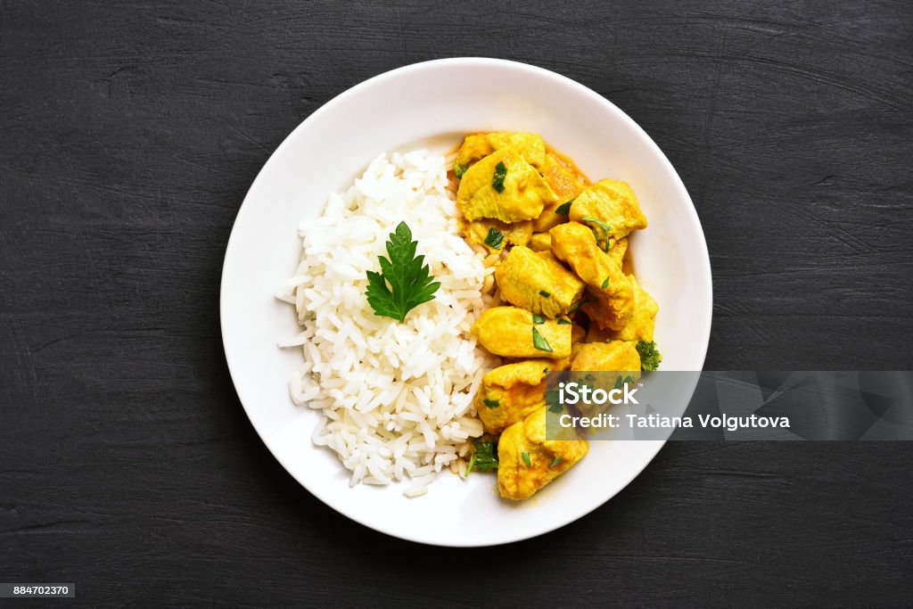 curry-Huhn mit Reis - Lizenzfrei Teller Stock-Foto