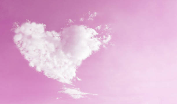 istock Heart shaped cloud on pink sky for Love and Valentines concept 884702606