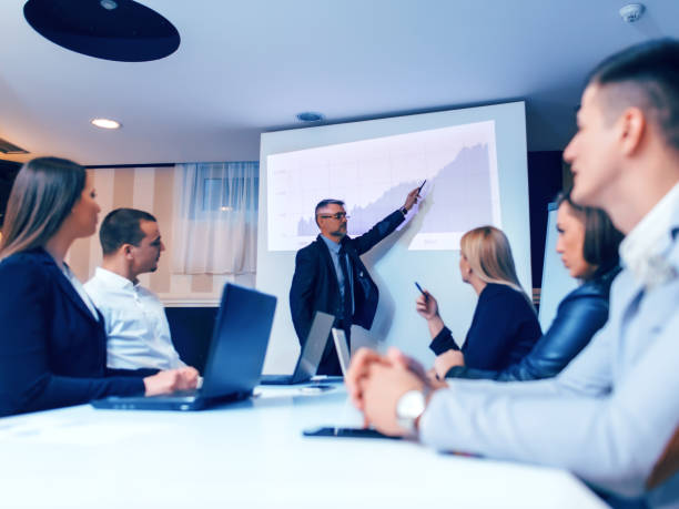 istock Businessman presenting to colleagues at a meeting 884710944
