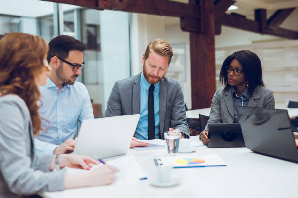 istock Business partners discussing documents and ideas at meeting 884713728