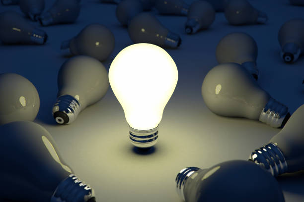 istock Bright Idea Standing Out Of the Crowd Light Bulb 884722638