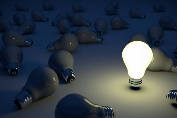 istock Bright Idea Standing Out Of the Crowd Light Bulb 884722726
