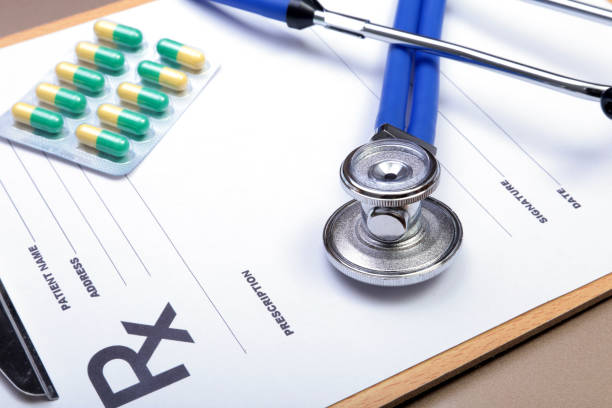 istock RX prescription, Red heart, asorted pils and a stethoscope on white background 884722756