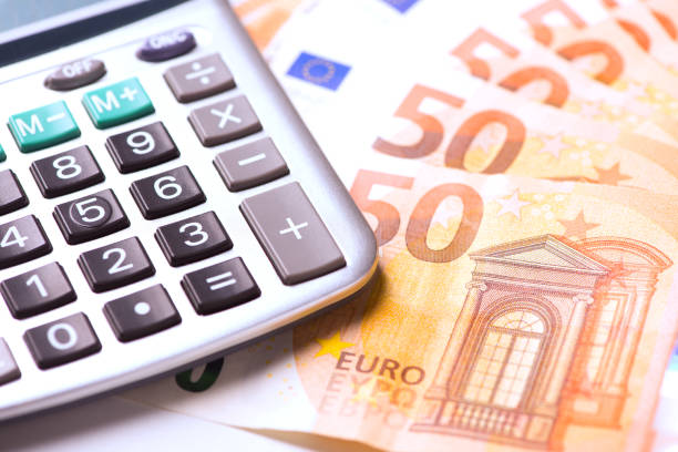 istock Euro money and calculator 884726214