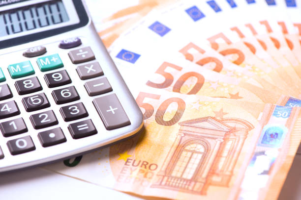 istock Euro money and calculator 884726398