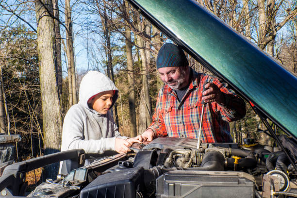 istock A father and son working on a SUV or truck 884726414
