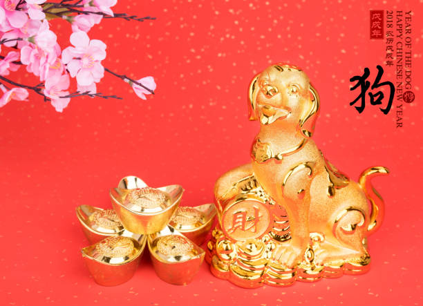 istock golden dog statue on red paper 884727282