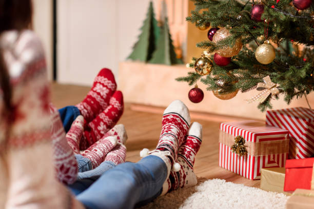 istock family in knitted socks 884727404
