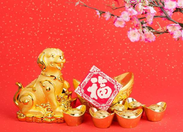 istock golden dog statue on red paper 884727800