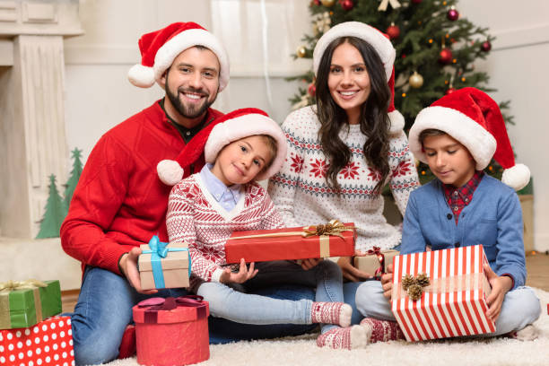 istock family with christmas presents 884730930