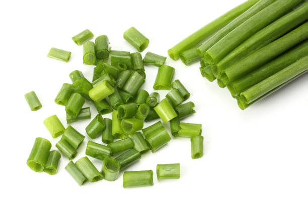 istock cut of green onion isolated on white background 884732228