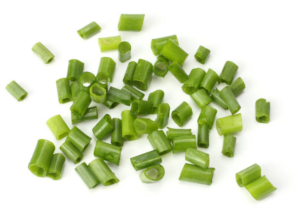 istock cut of green onion isolated on white background 884732232