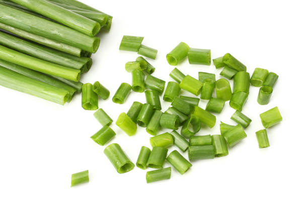istock cut of green onion isolated on white background 884732246