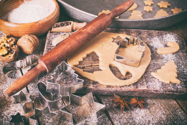 istock Making Christmas Cookies with traditional gingerbread cookies ingredients 884736378