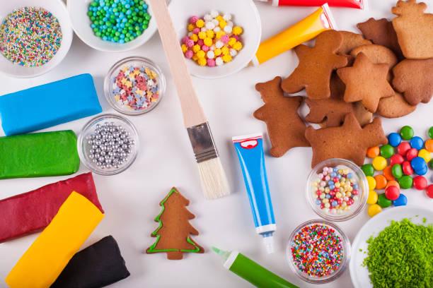 istock Supplies for preparing Christmas cookies decoration on a white table 884736538
