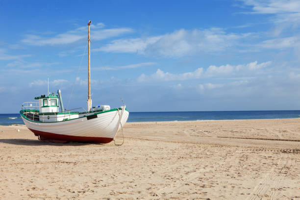 Fishing boats stranded on the beach at low tide
